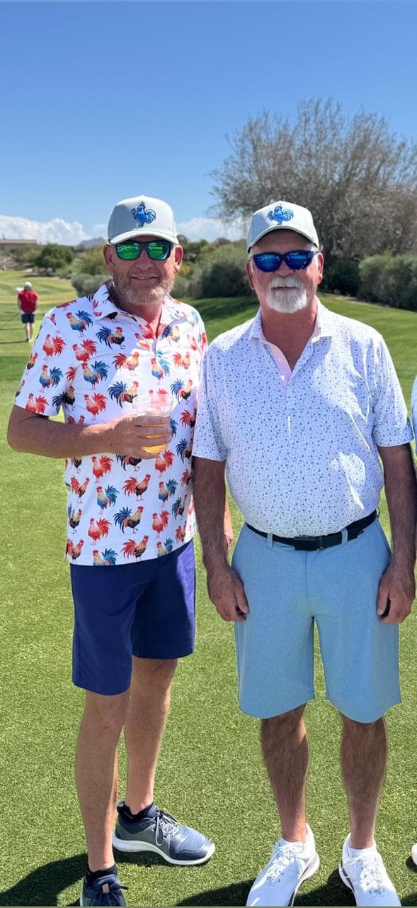 2026 captains Ronnie Rush and John Carson standing on the course